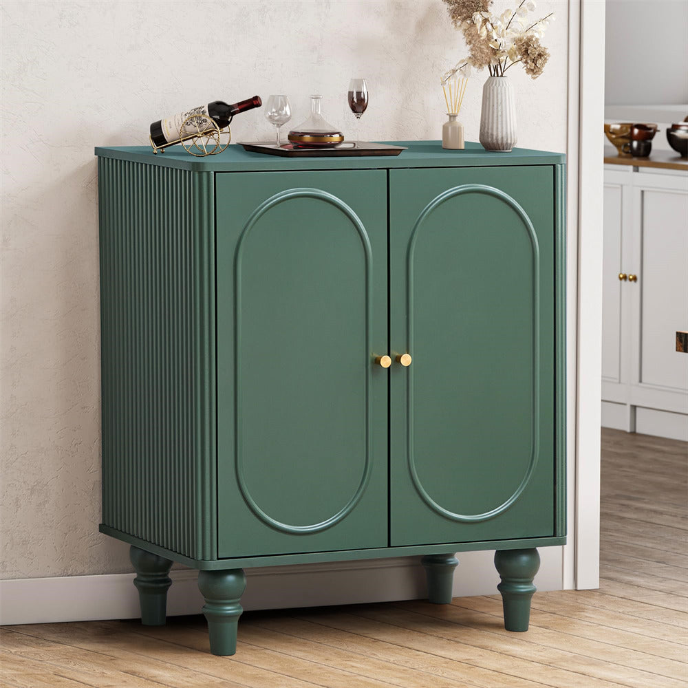 Green cabinet with gold handles in a room setting