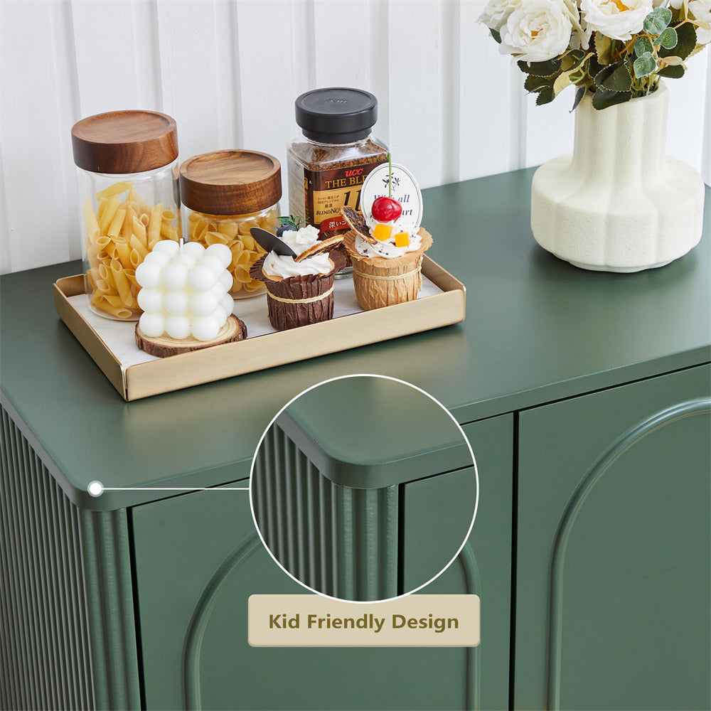 Green cabinet with decorative items including jars, a tray with small models, and a vase with flowers.