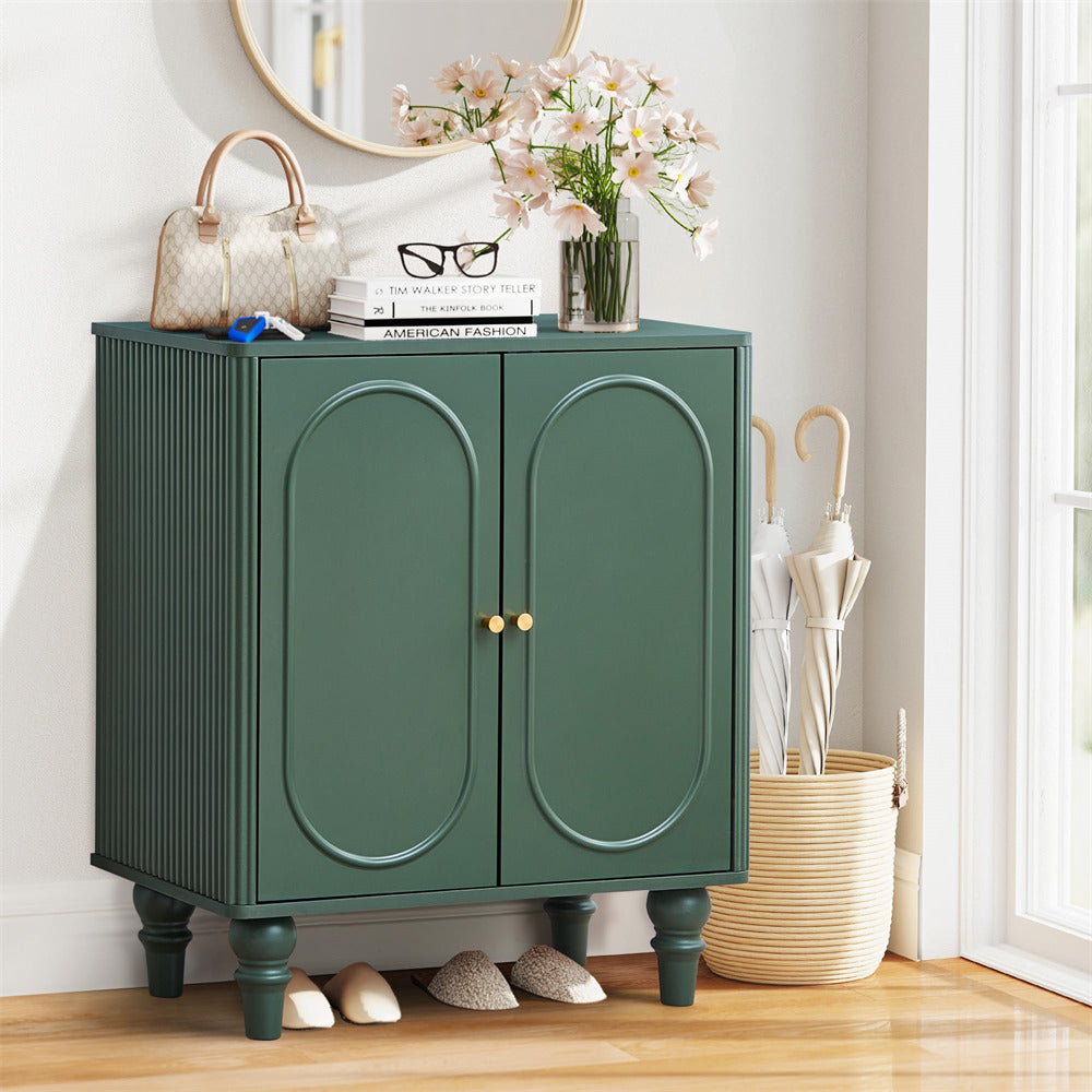 Green cabinet with decorative items on a wooden floor