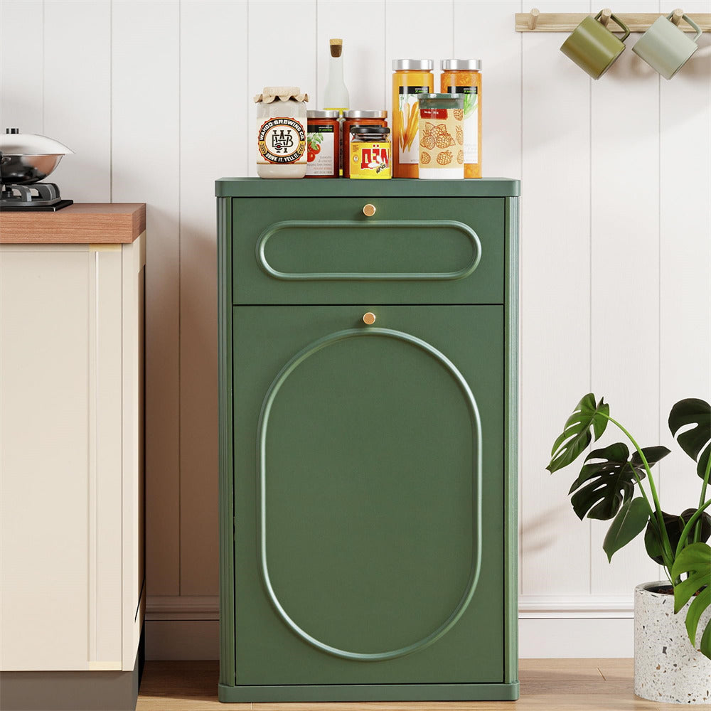 Green cabinet with decorative jars on a wooden surface in a kitchen setting