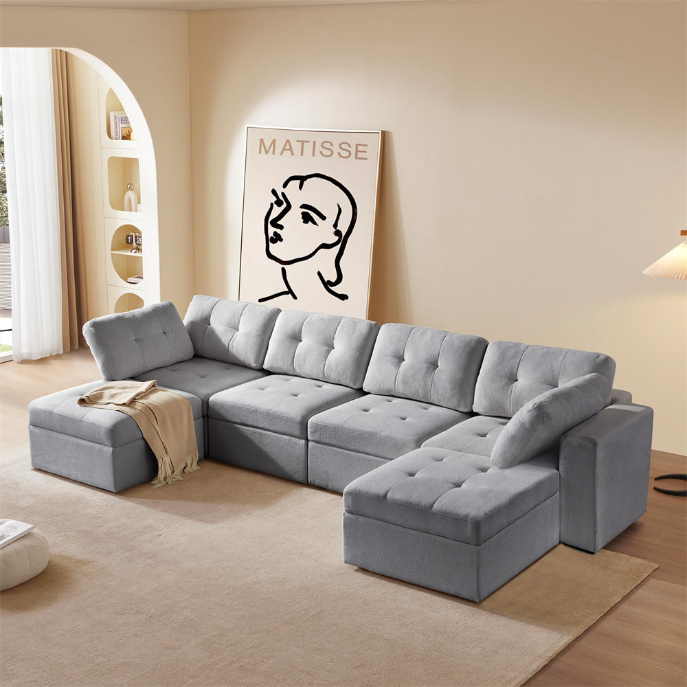 Gray sectional sofa in a living room with a Matisse painting on the wall.