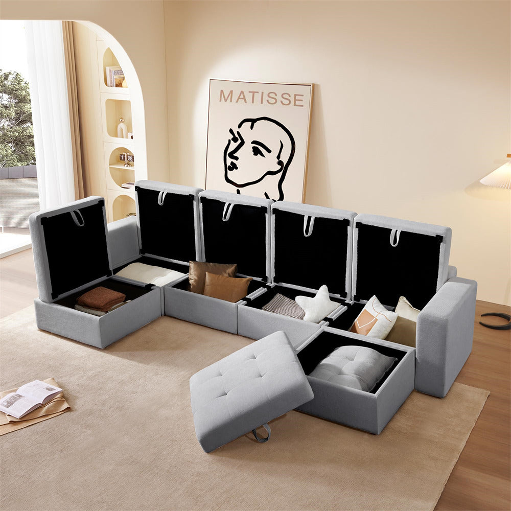 Gray sectional sofa with storage compartments in a living room setting.