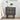 Decorative nightstand with floral patterns, lamp, and plant in a bedroom setting.
