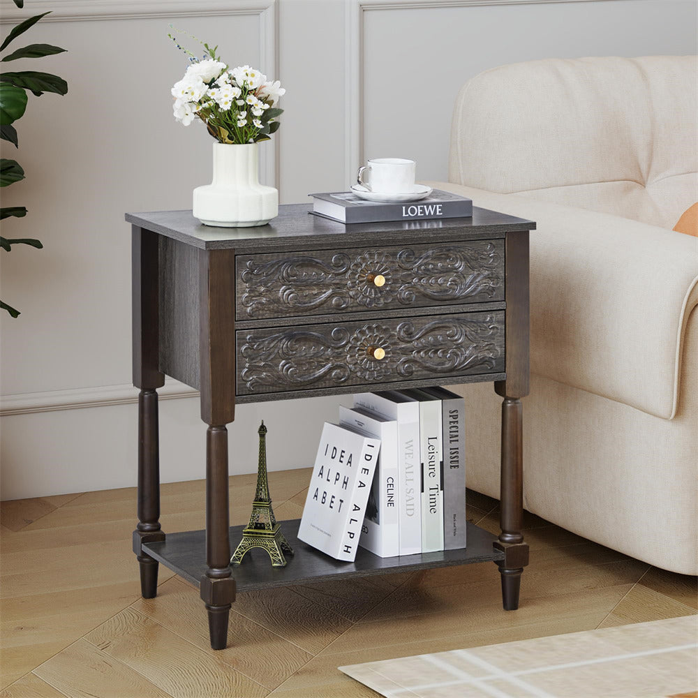 Decorative grey side table with books and a cup in a living room setting