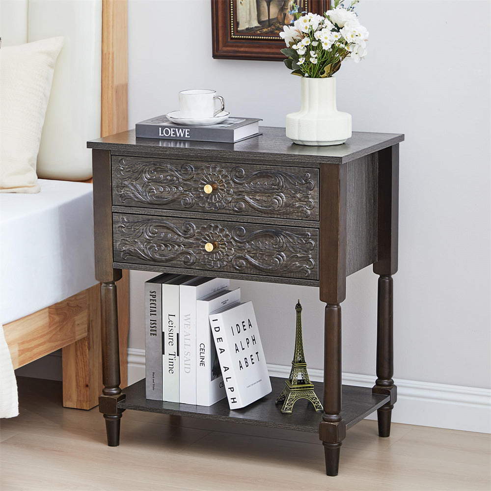 Decorative grey nightstand with books and a vase in a bedroom setting