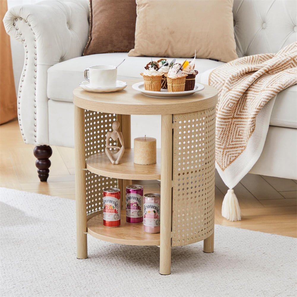Round wooden side table with cans and a plate of snacks in a living room setting.