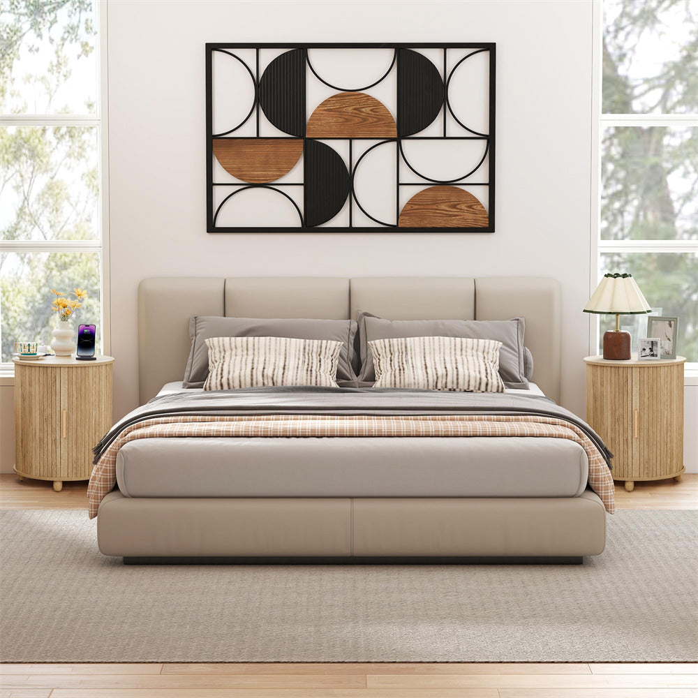 Modern bedroom with a bed, side tables, and decorative wall art.