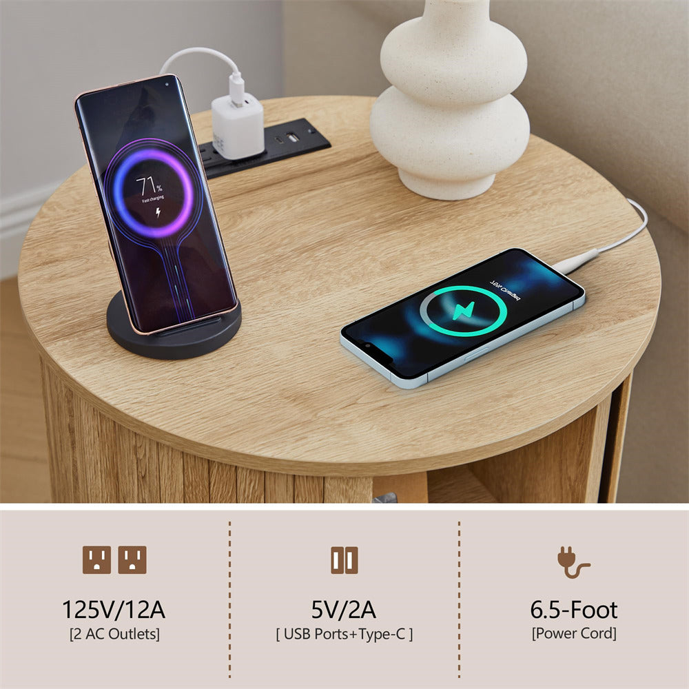 Two smartphones charging on stands with a power adapter on a wooden table.