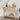 Wooden console table with decorative items against a white wall.