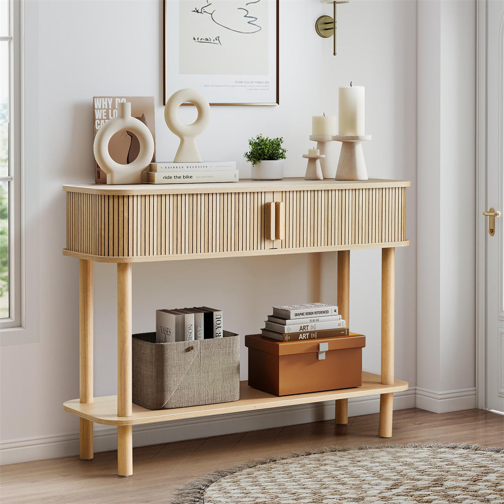 Wooden console table with decorative items in a room setting