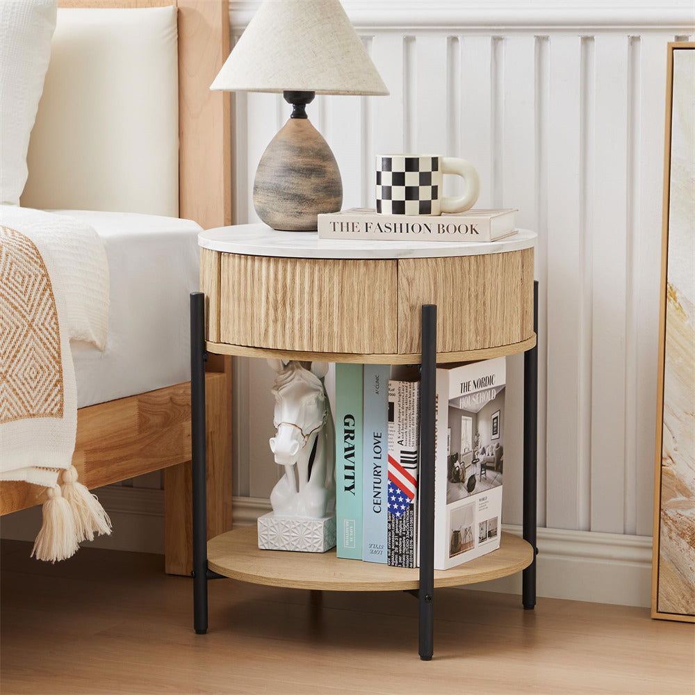 Wooden side table with books and decor items next to a bed