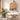 Bathroom interior with wooden cabinet, sink, and plants