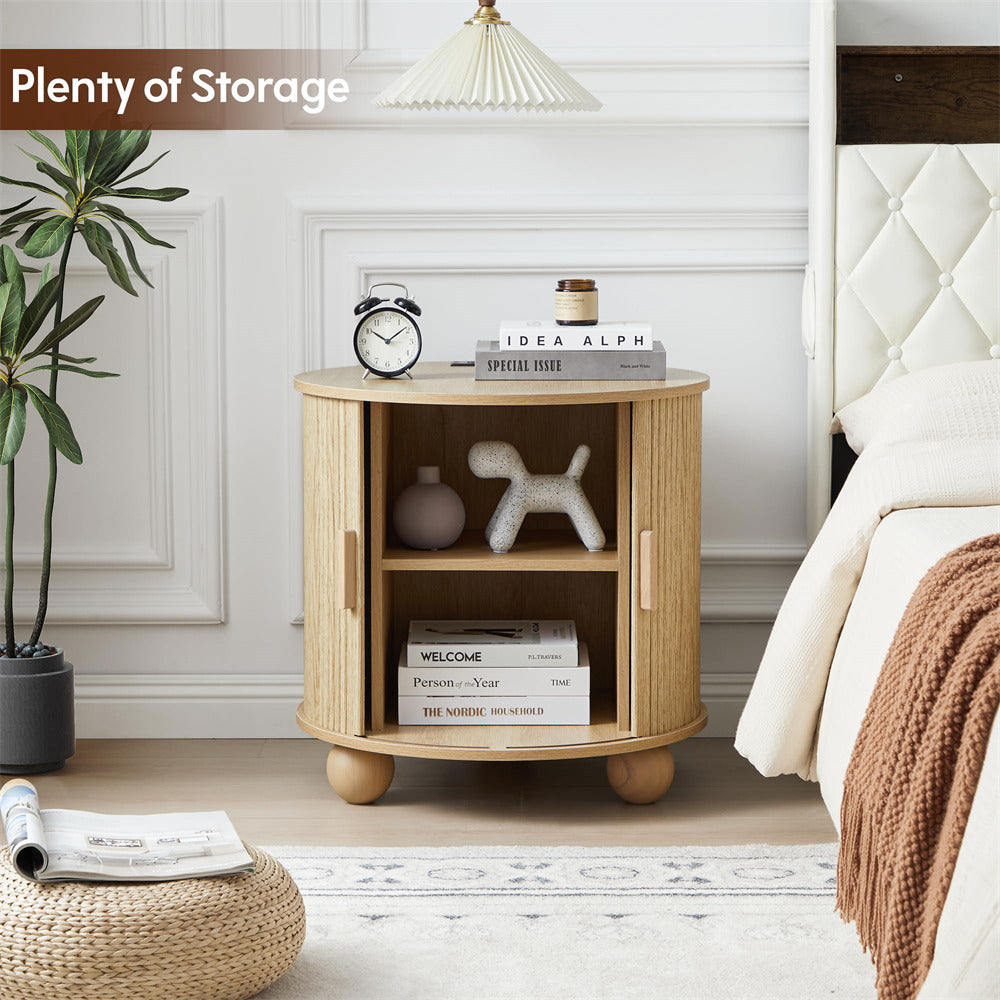 Wooden side table with storage compartments in a bedroom setting.