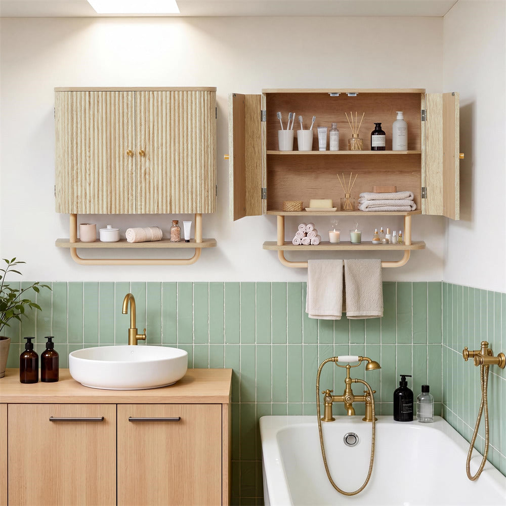 A styled bathroom interior showing wall-mounted wooden storage cabinets and shelves with toiletries, a white vessel sink on a light wood vanity, pale green tiled wall, and part of a white bathtub with brass fixtures.
