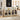 Light wood storage cabinet with glass doors in a kitchen setting, featuring appliances and decor.
