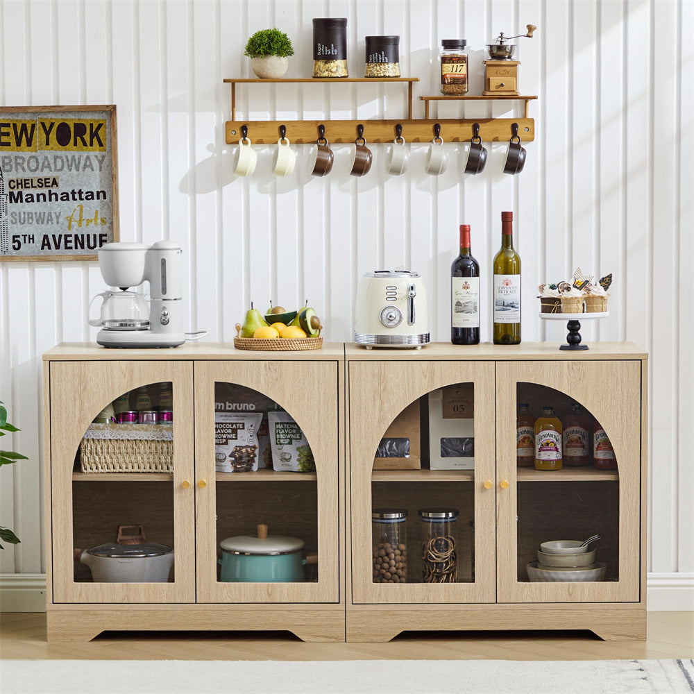 Wooden kitchen cabinet with glass doors displaying kitchen items, placed against a white wall.