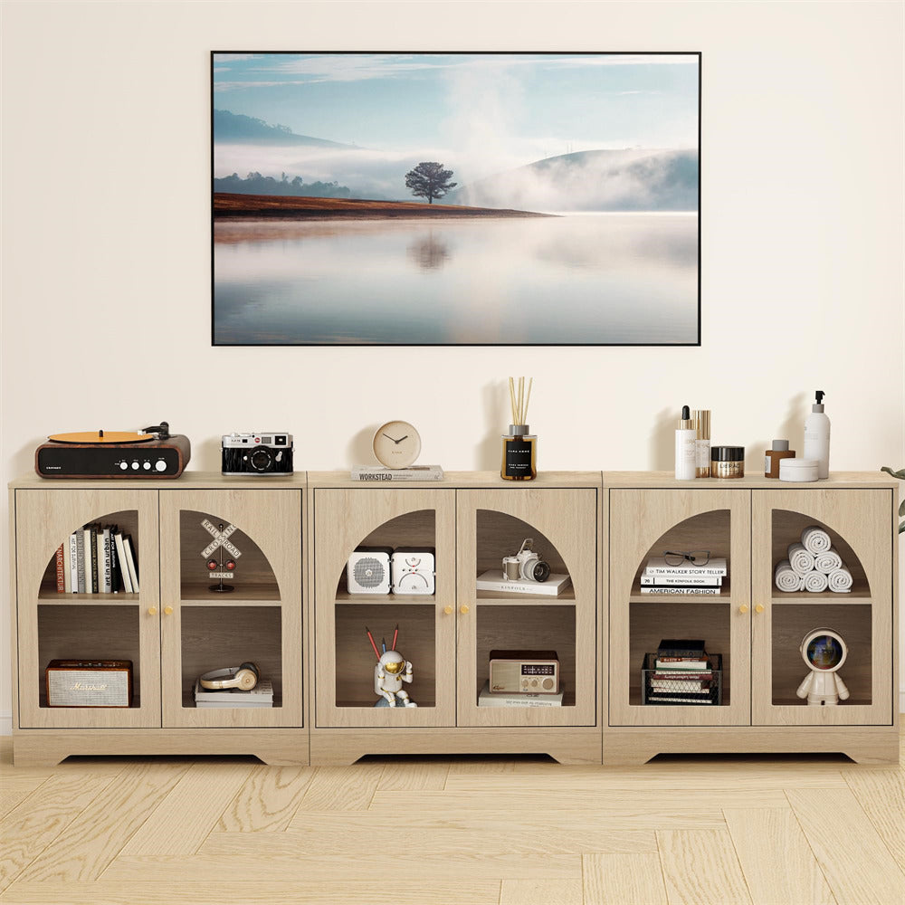 Modern entertainment console with decorative items and a TV displaying a nature scene.