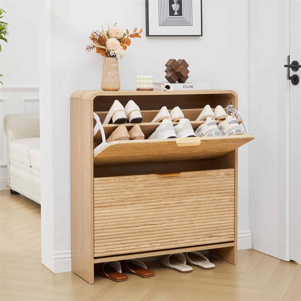 Wooden shoe cabinet with shoes on a light wooden floor.