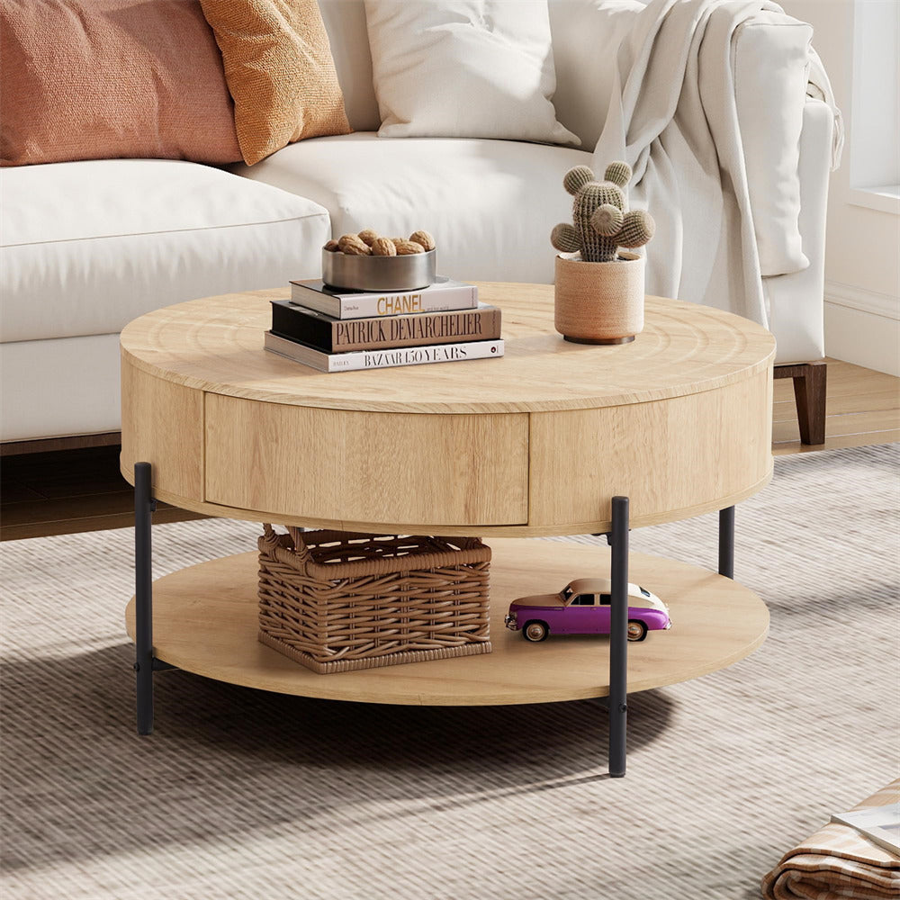 Round wooden coffee table with decorative items in a living room setting.