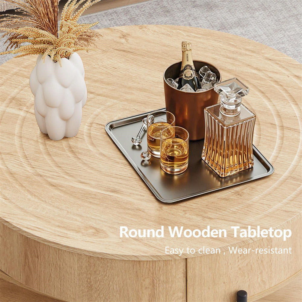 Round wooden table with drinks and decor items on a light wood surface
