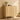 A light natural wood cabinet with two doors featuring a ribbed arched panel design, styled in a warm, minimalist room with a wooden wall, potted plants, and a woven rug.