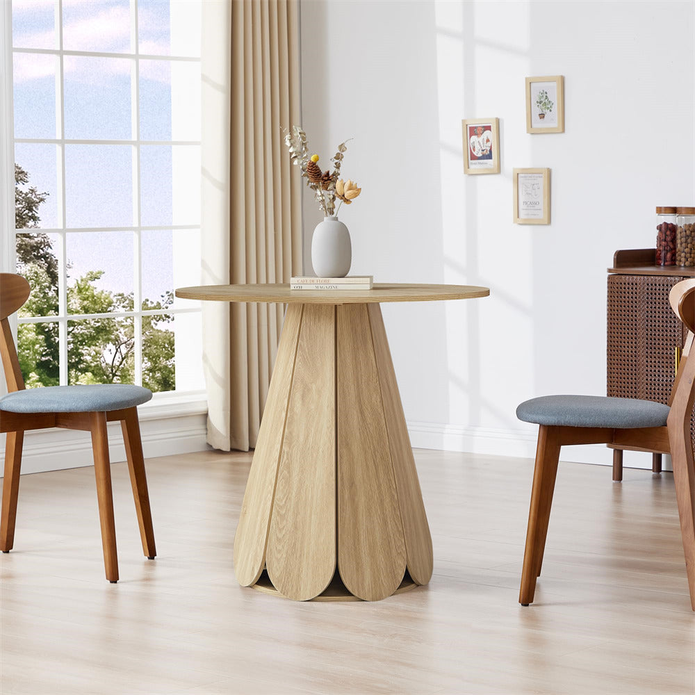 Dining table with chairs in a bright room with large windows