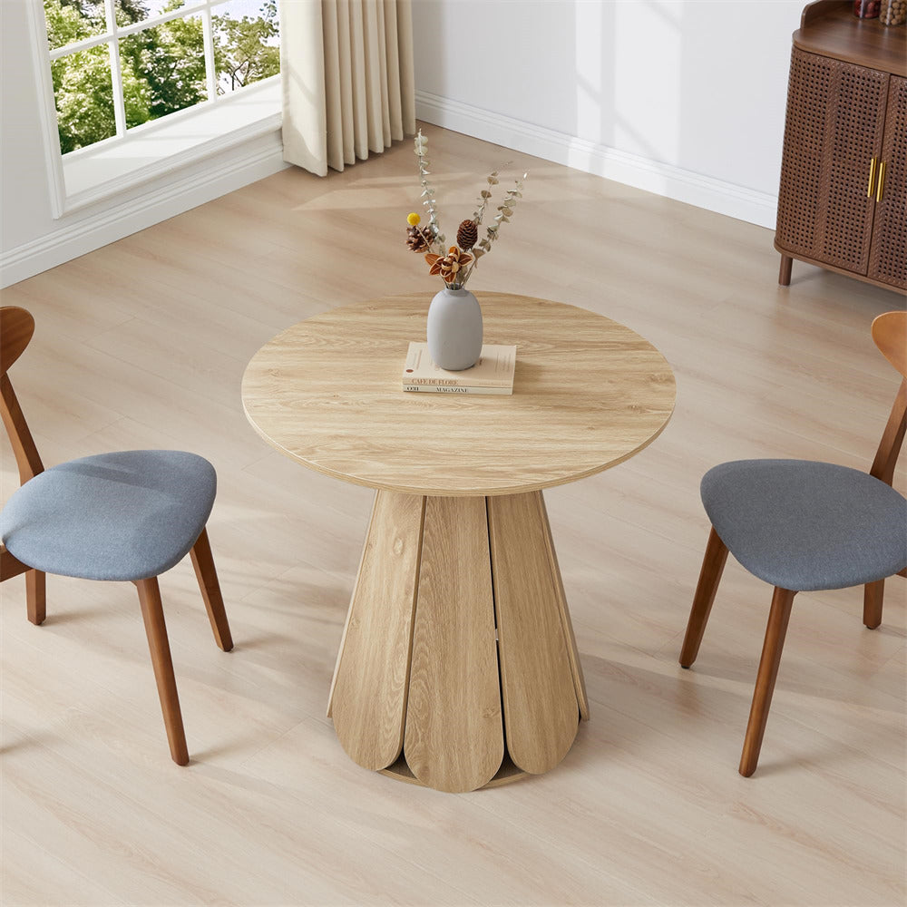 Round wooden table with two chairs in a room with a window and cabinet.