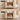 Wooden cat condo and litter box with a cat inside, on a beige background.