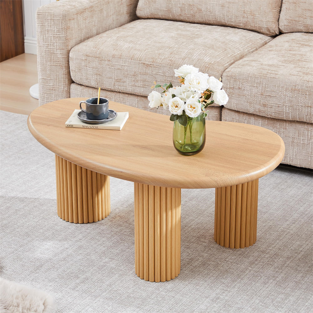 Wooden coffee table with decorative items in a living room setting