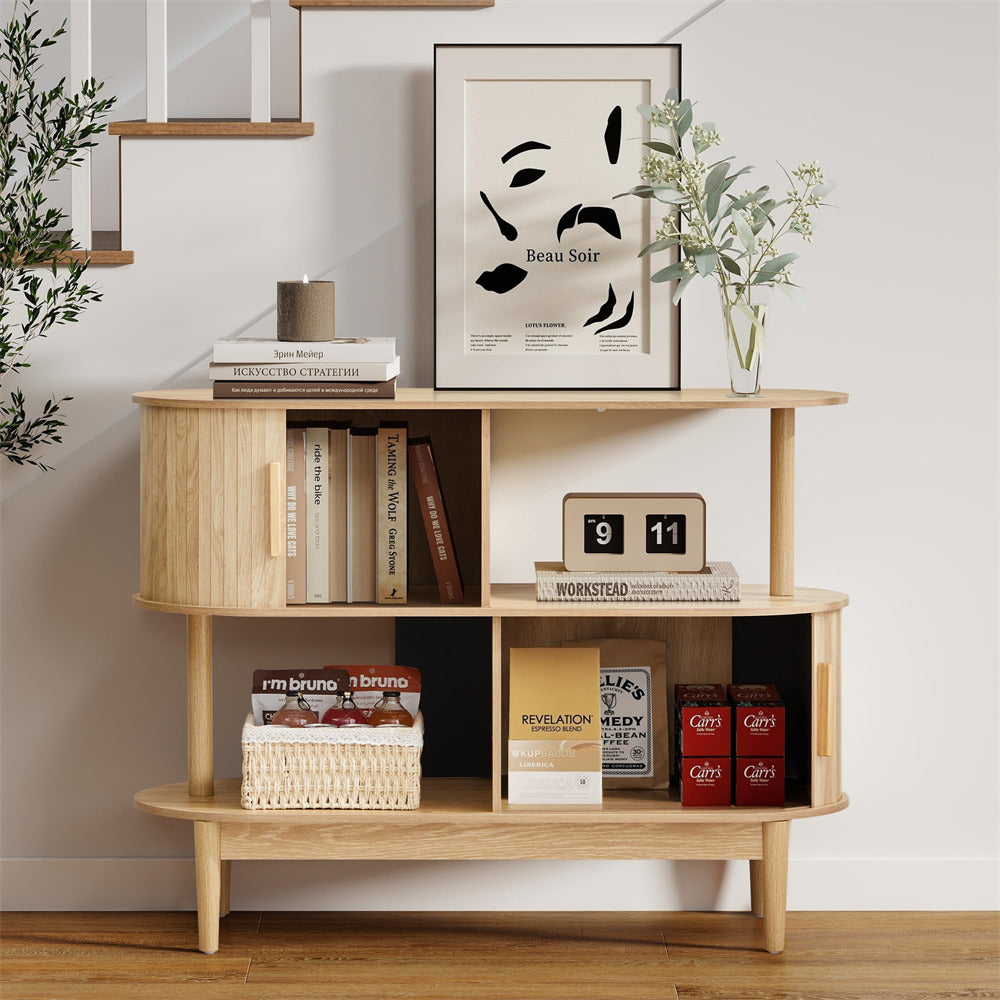 Wooden shelf with books, a calendar, and decorative items against a white wall.