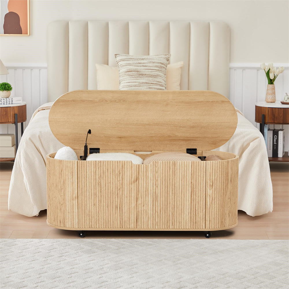 Wooden storage ottoman with open lid in a bedroom setting