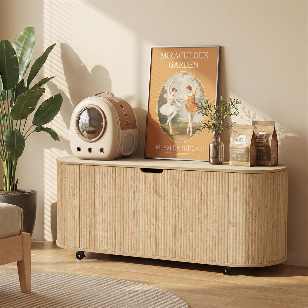 Wooden side table with decorative items including a poster and plant in a room with sunlight streaming in.