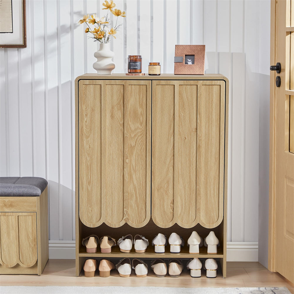 Wooden 5-tier shoe cabinet with shoes inside, placed against a white wall.