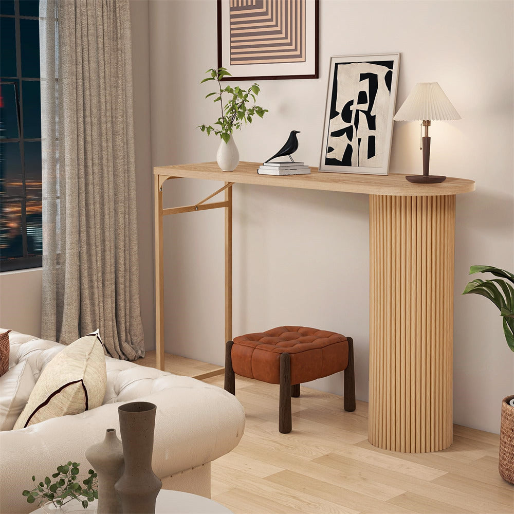 Wooden console table in a living room setting with decor items.