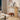 Wooden console table in a living room setting with decor items.
