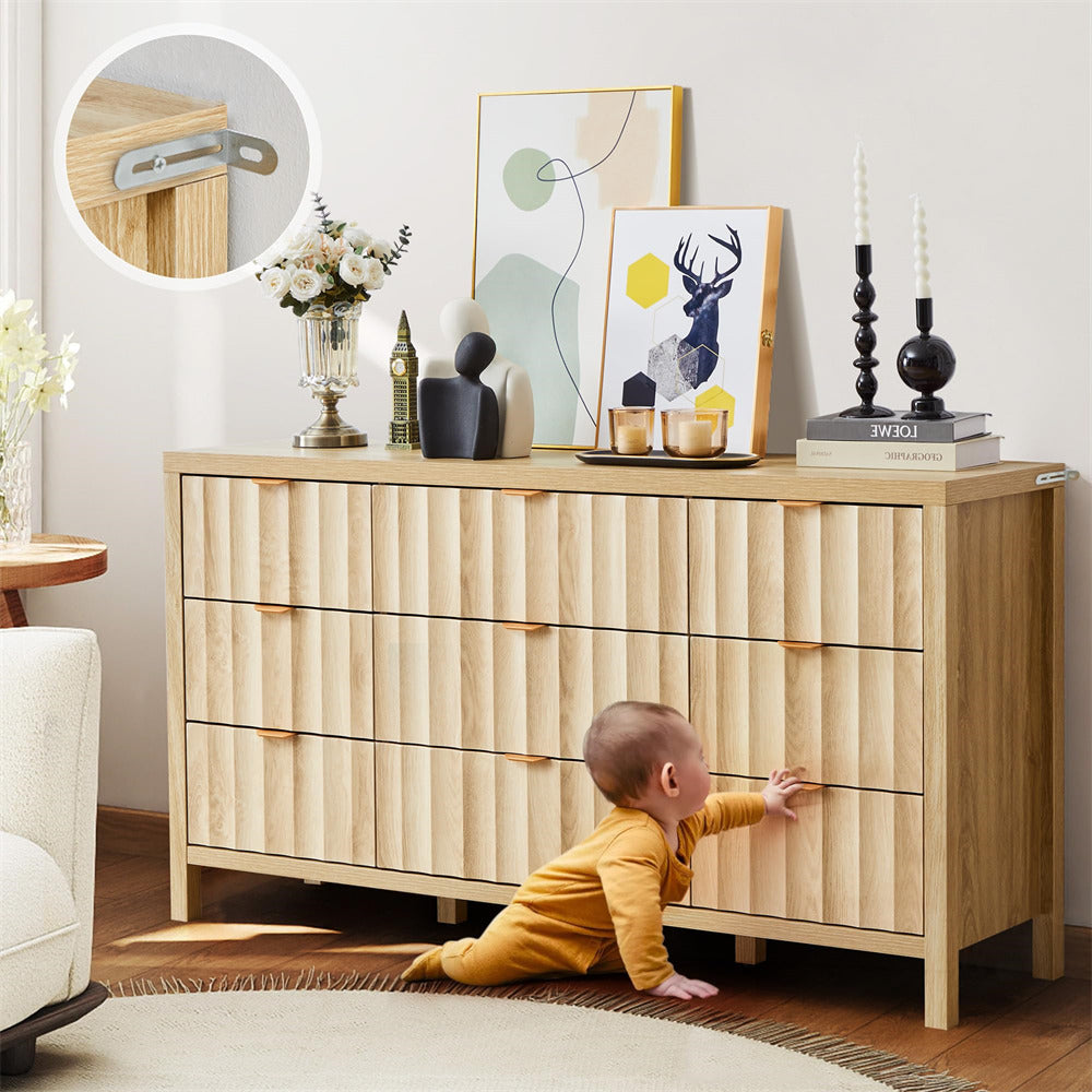 Child playing with a wooden dresser in a room with decor elements.