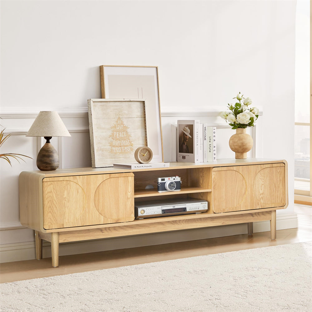 Wooden 59" TV stand with decorative items in a room with a light-colored wall and carpet.