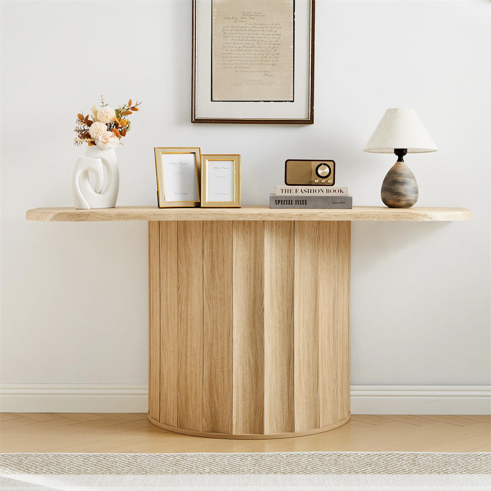 Wooden console table with decorative items against a white wall