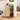 Wooden kitchen cabinet with appliances and jars in a home setting