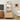 Wooden cabinet with decorative items in a living room setting, featuring a cat eating from a bowl.