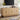 Light wood sideboard with decorative items in a living room setting