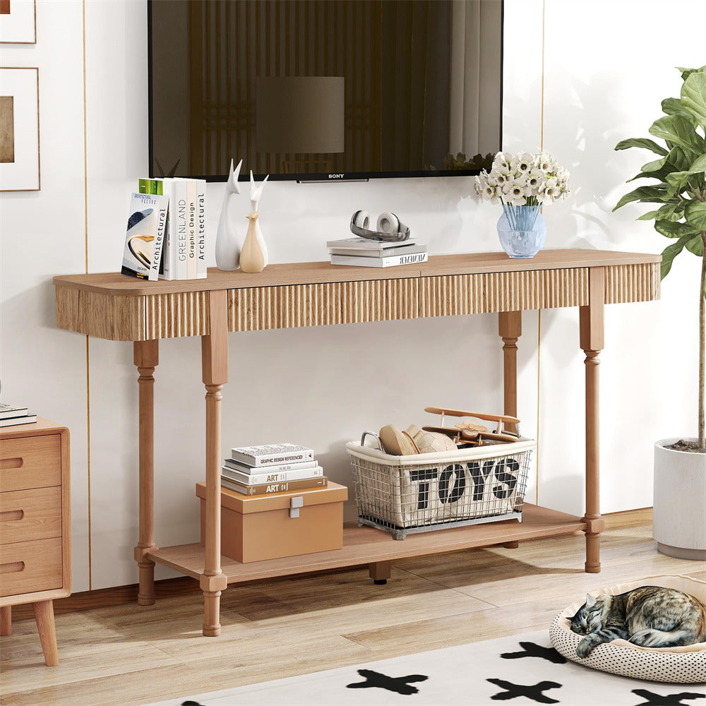 Wooden 63" console table in a living room with books, a basket labeled 'TOYS', and decorative items.