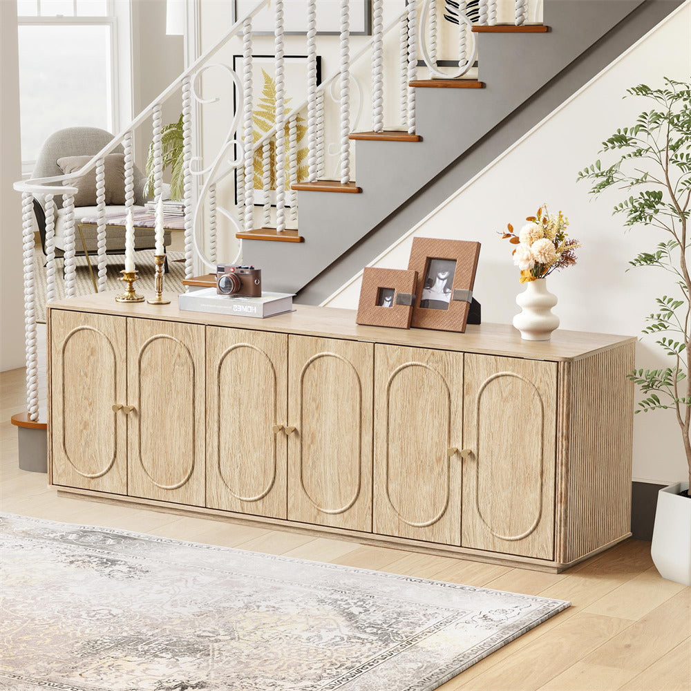 Light wood sideboard with decorative items in a home setting
