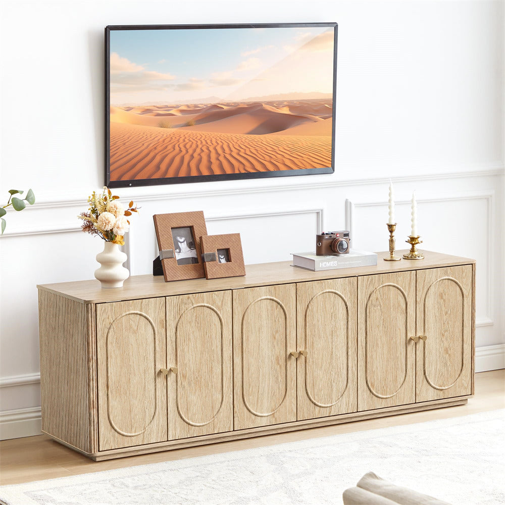 Wooden entertainment console with decorative items in a living room setting