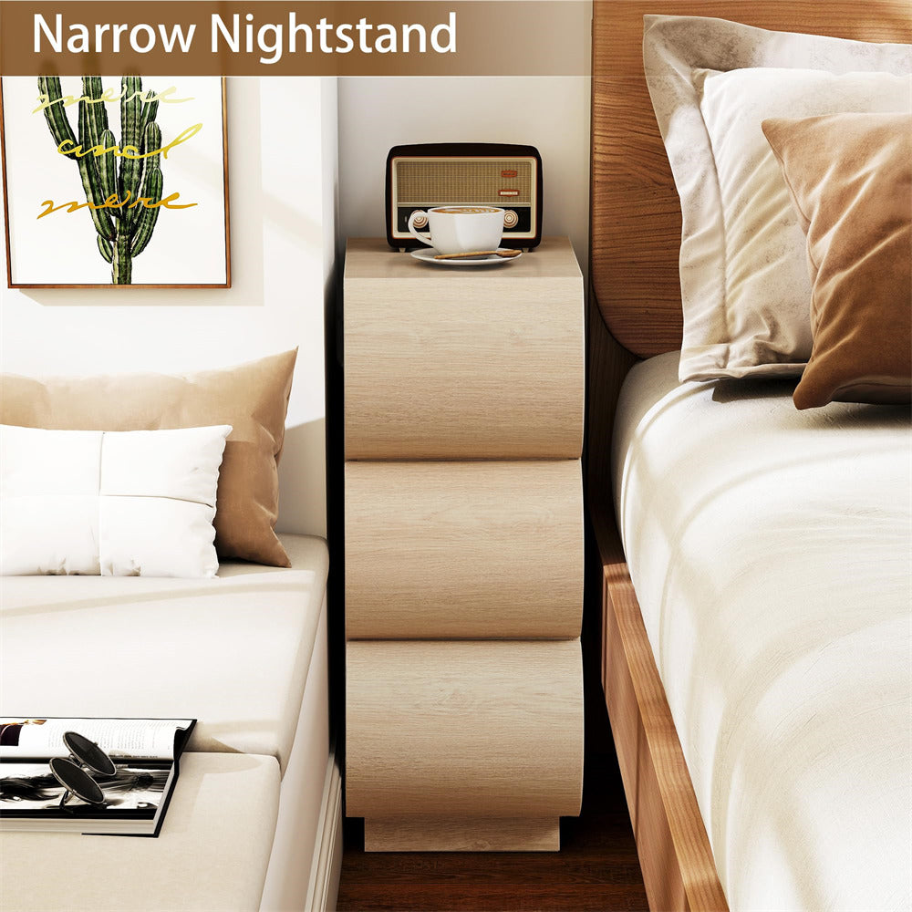 Narrow nightstand between a bed and sofa in a bedroom setting