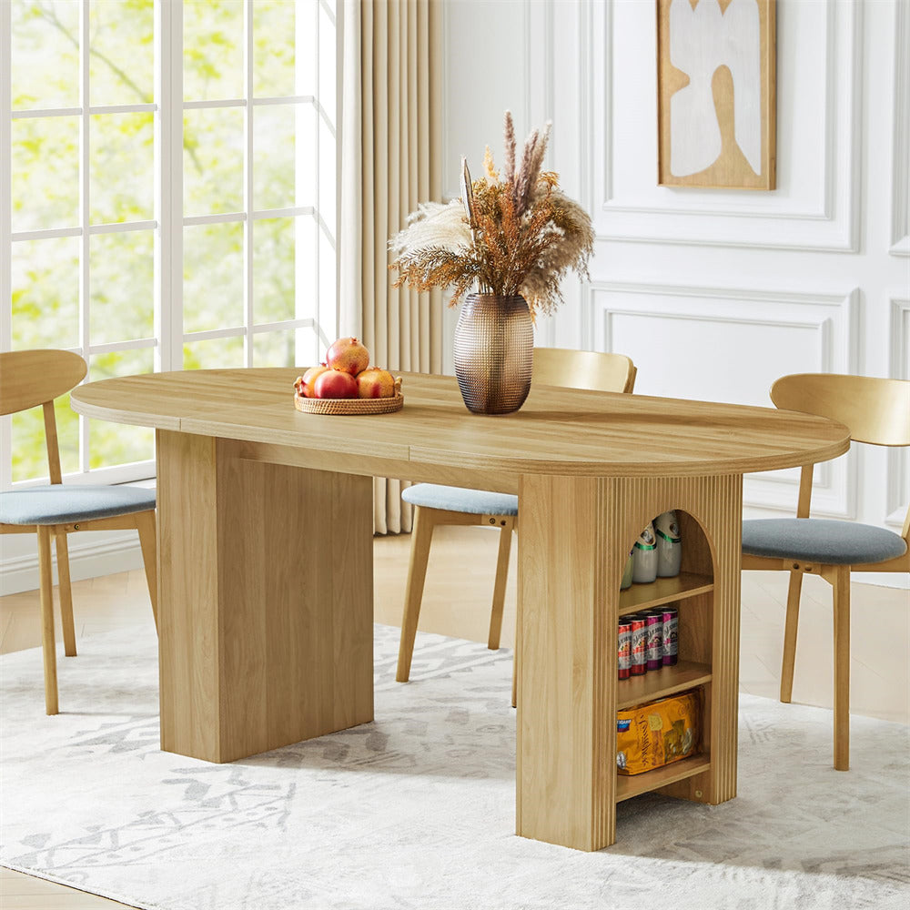 Wooden dining table with chairs in a bright room with large windows.