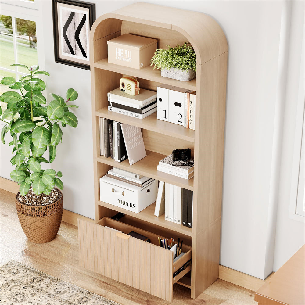 Wooden bookshelf with books and decorative items in a room with a plant and framed picture.