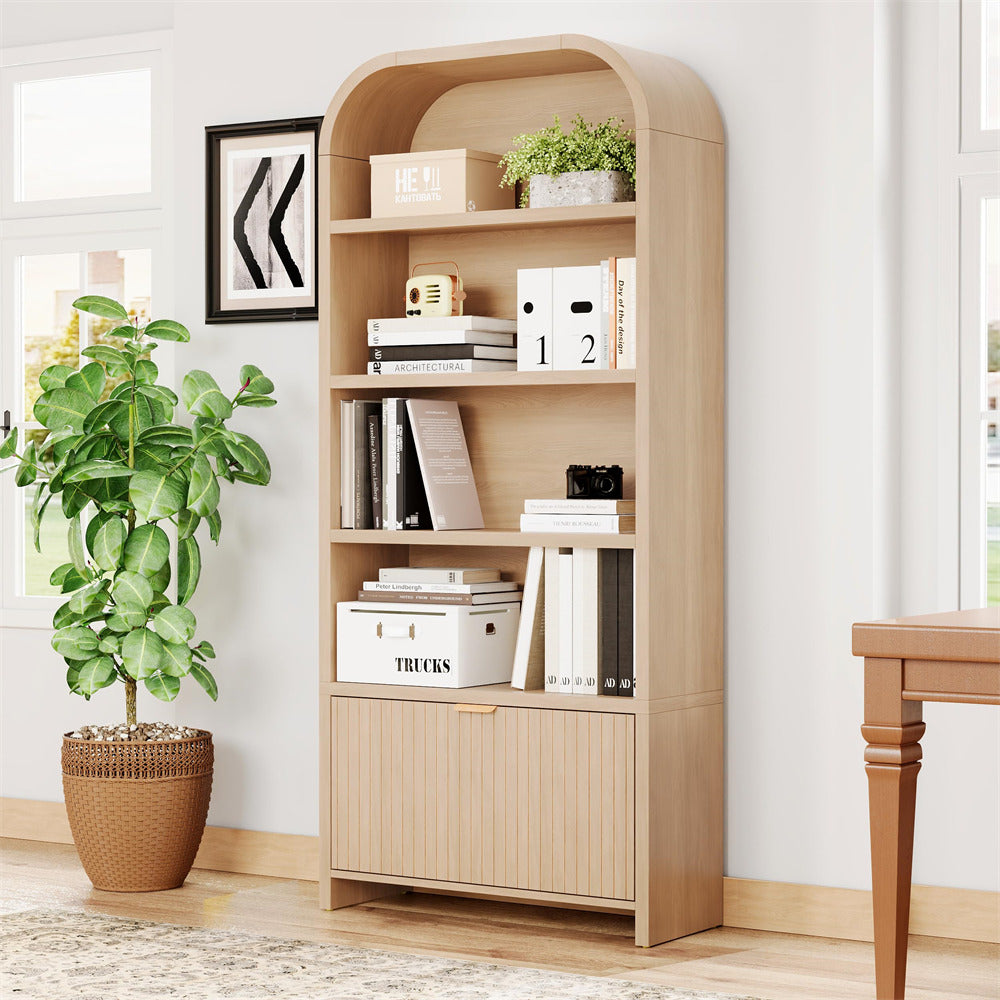 Wooden bookshelf with decorative items in a room with a plant and table.