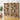 Large wooden bookshelf filled with books and decorative items in a room with a plant and sofa.