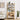 Wooden bookshelf with decorative items in a living room setting